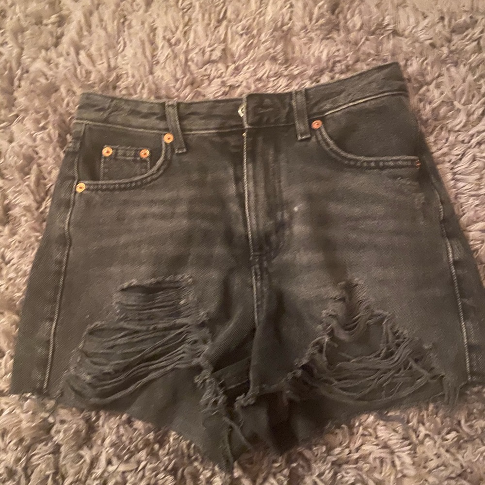 Topshop black distressed denim shorts.